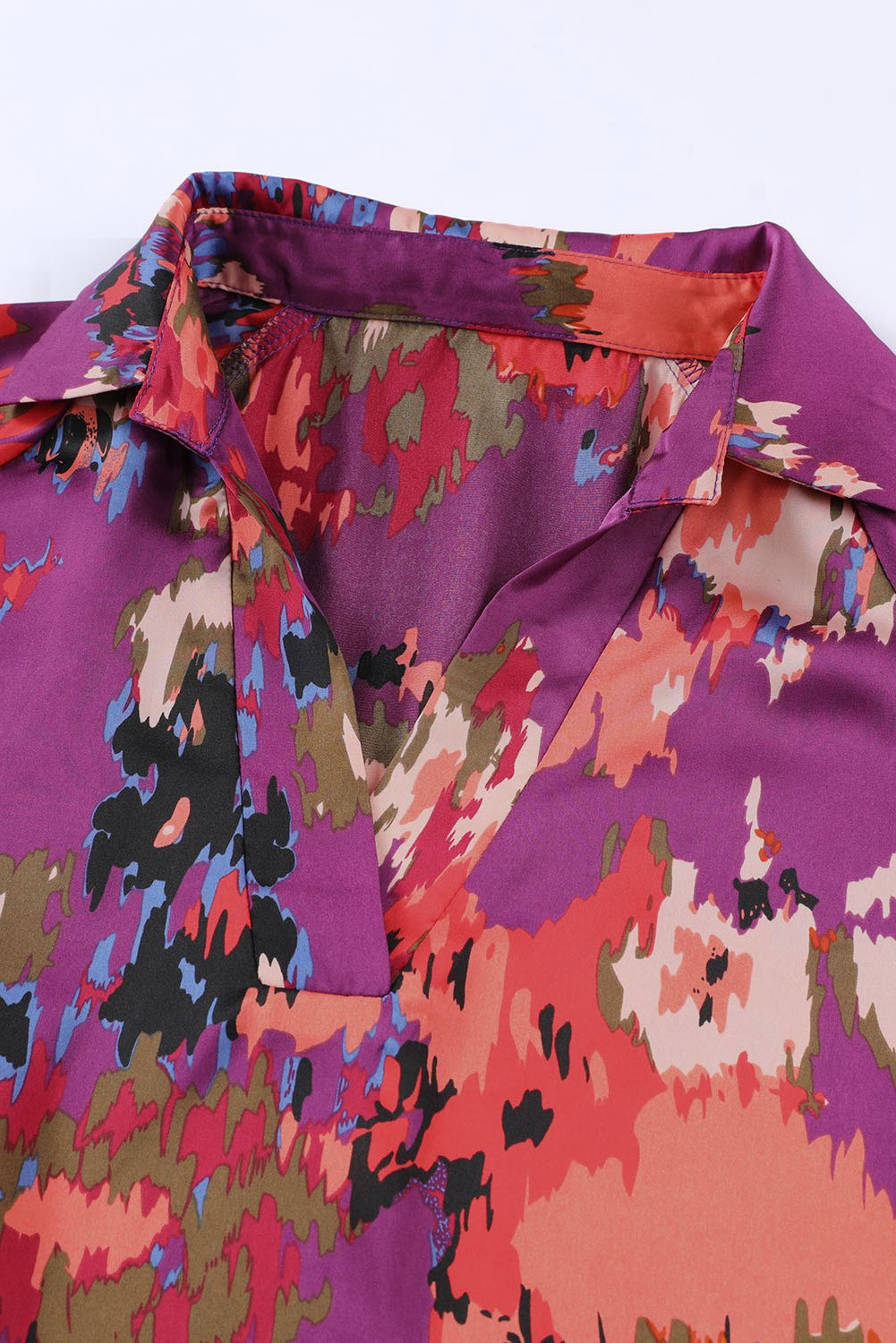 We love the colors in this watercolor print blouse. This flattering top features a collared v-neck, flowy cut, and oversized sleeves that button at the wrist. Looks perfect with a front tuck in jeans. 