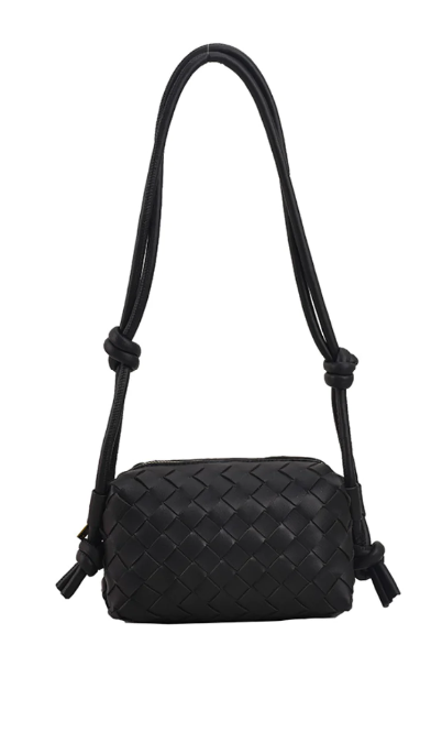 Make a fashion statement with this trendy and versatile shoulder bag! The classic braid design in black will add a splash of chicness to any outfit. It's sure to turn heads.