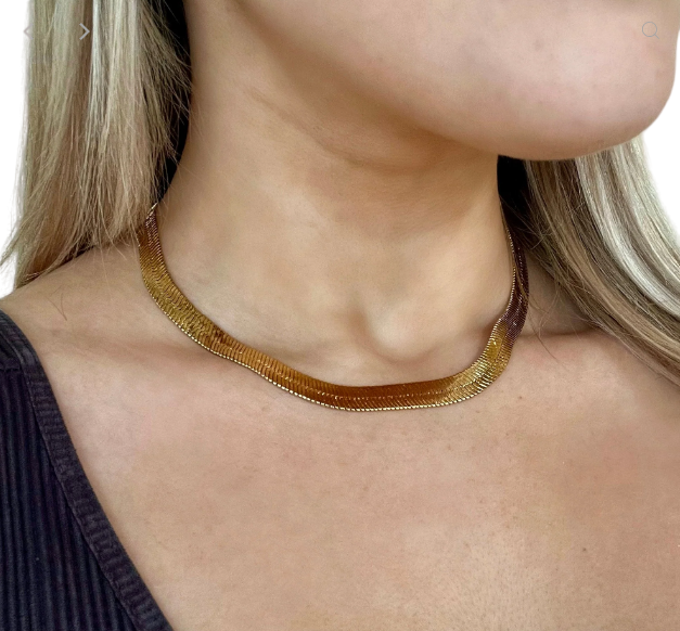 Bring classic style to your wardrobe with our Herringbone Choker Necklace. Unique yet versatile, this stunning piece adds effortless charm to all your outfits and won't break the bank. Adorn yourself with elegance while investing in a timeless treasure! 16" with 2" extender 10mm width stainless steel