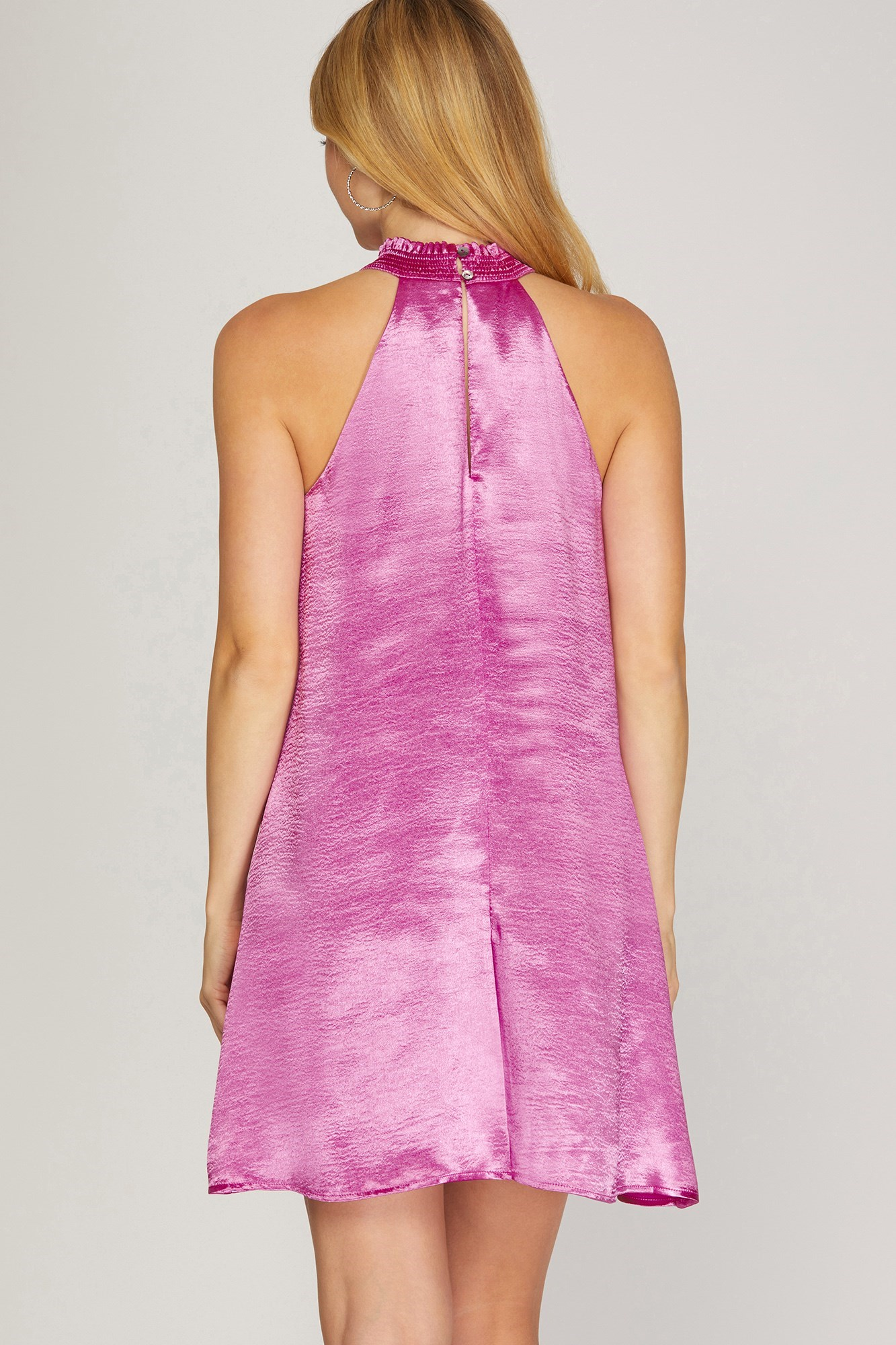 High neck with smocked detail, textured satin dress. Lined, button closure at back of the neck. 