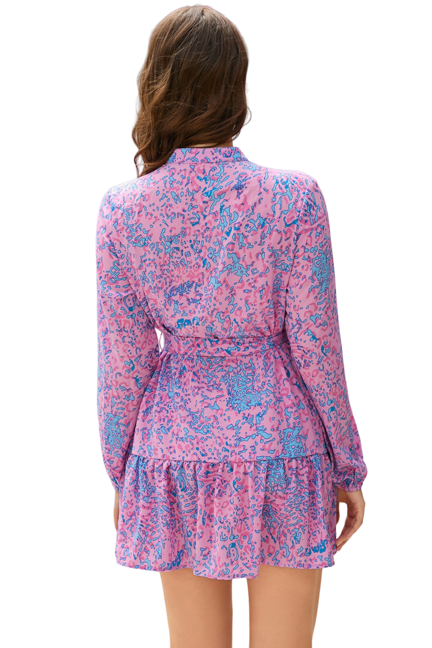 Pretty in pink and blue, such a fun print! This chic shirt dress buttons down the front, has a ruffle trim hem and tie waist. 