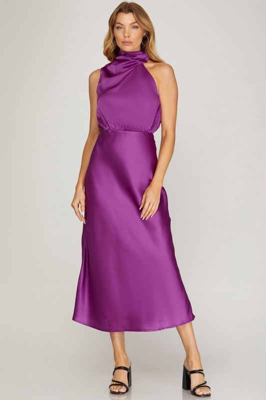 A sleek, sleeveless midi dress crafted with a bold, asymetrical neckline.