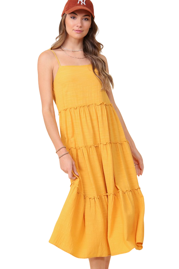 This solid canary colored midi dress features a tiered design, shoulder tie straps and textured fabric with a linen feel. 